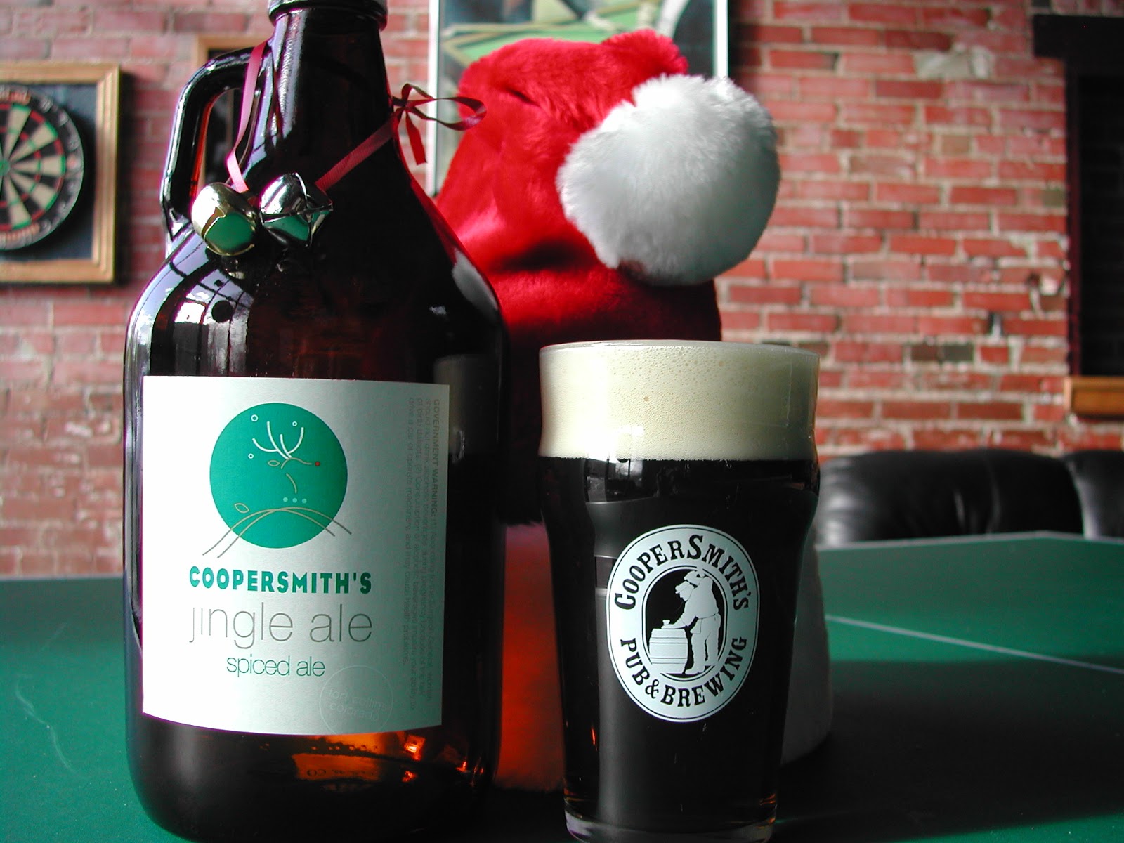 jingle ale growler next to santa hat and pint of beer